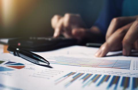 PHOTO: Thinkstock.com. Close up pen on paperwork and woman hand calculate finance.